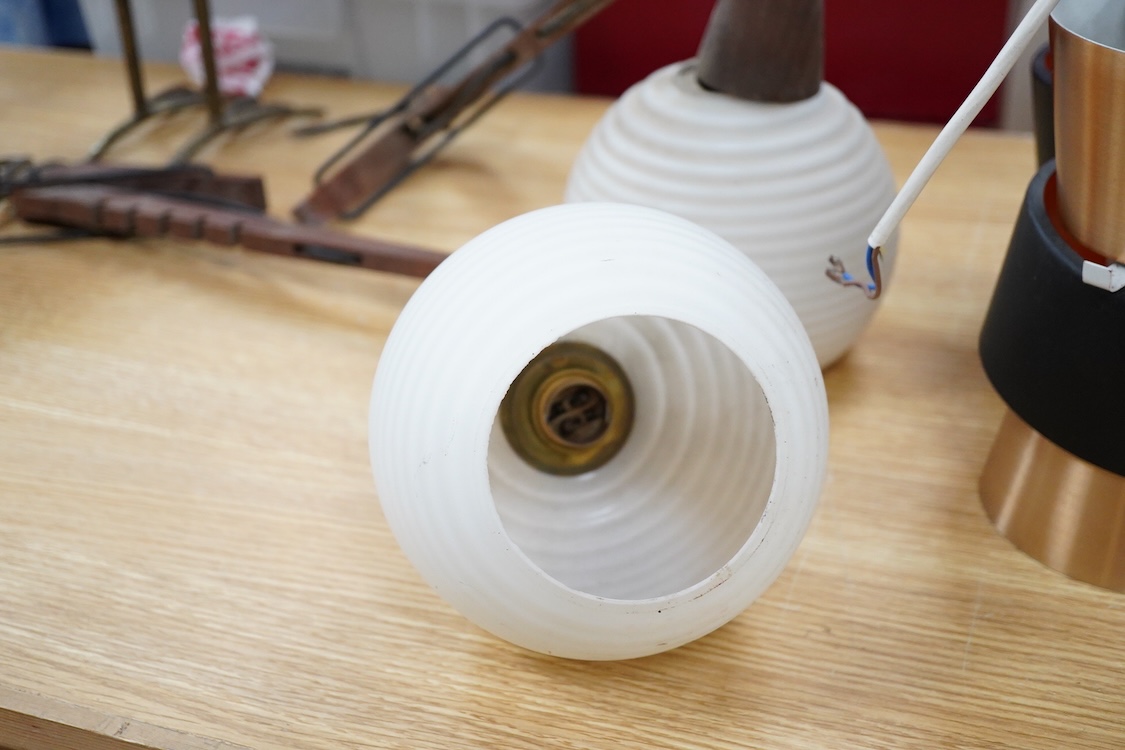 A pair of 1960s teak and opaque glass adjustable light fittings